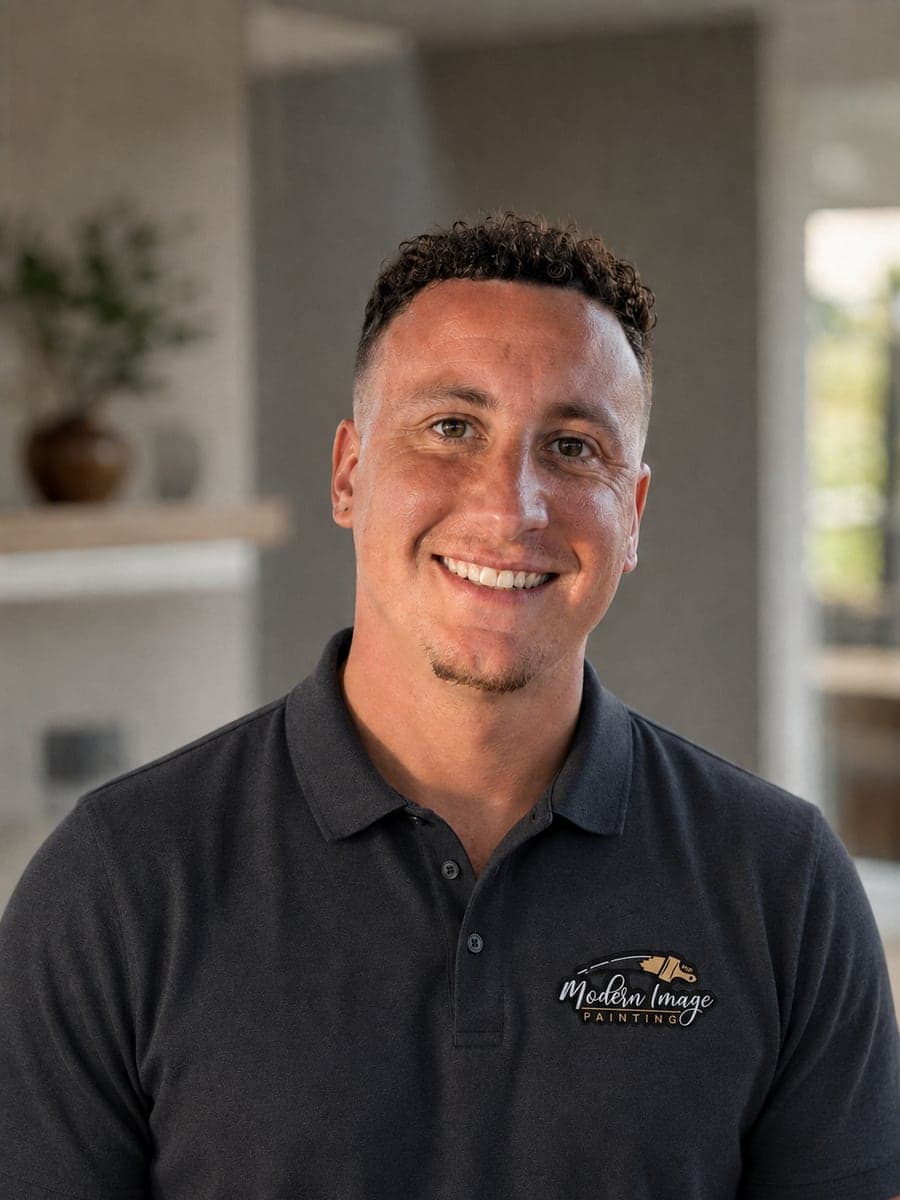 Justin Howell, owner of Modern Image Painting, in a branded company polo shirt